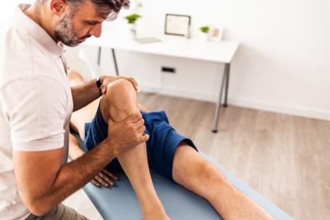 Therapist helping patient